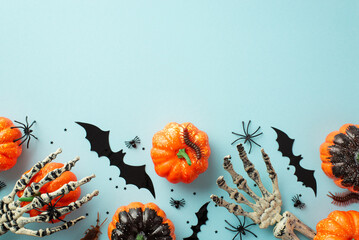 Halloween decorations concept. Top view photo of pumpkins bat silhouettes skeleton hands spiders...