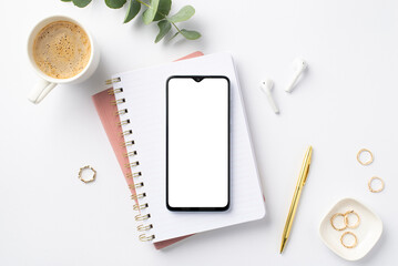 Business concept. Top view photo of workstation smartphone over planners cup of coffee wireless...