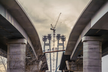 Lifting tower crane at bridge construction