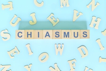 Chiasmus figure of speech concept in English grammar class lesson. Wooden blocks typography flat lay in blue background.	