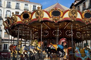 Madrid, Spain, August 25, 2022: Classical carousel with animal characters in the city center of Madrid  
