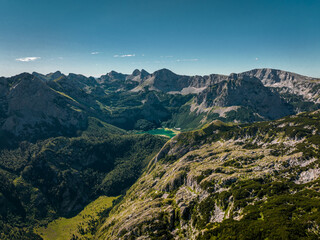 Fototapeta premium Alpine Lake in Mountains - Drone Aerial Shot - Balkan Alps