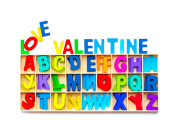 Wood Alphabet letters love valentine on white background. colorful letters toys. english font jigsaw. valentine greeting card copy space for add text message.