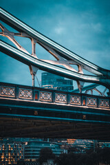 Illuminated Bridge in the evening and skyscrapers in the background