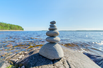 Pyramid of stones. Unstable balance of stone objects. Idyllic state of nature.