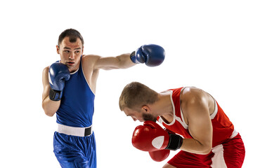 Fototapeta na wymiar Young men, professional boxers in sports uniform boxing isolated on white studio background. Concept of sport, competition, training, energy