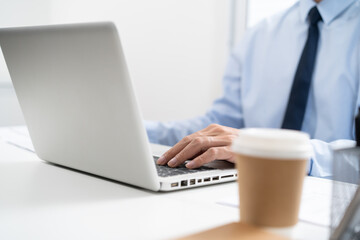 Business man working by using laptop computer Hands typing on a keyboard. Professional investor working new start up project. business planning in office. Technology business