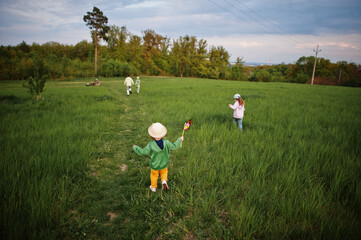 Children having fun together at meadow.