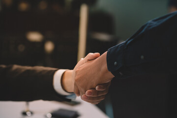 Businessman making agreement at office. it's a contract paper. Human hand holding pen mystery document on the table. It's a big decisions for business corporate.