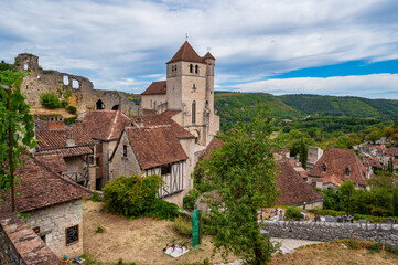 Fototapeta na wymiar France, Lot, Saint-Cirq-Lapopie, labelled Les Plus Beaux Villages de France, 15th century fortified Roman church. High quality photo