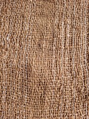 Textured Burlap Background with copy space. Top view on rustic table with burlap tablecloth. Fabric Background.