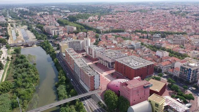 Panoramic view of Perpignan city center and Tet river on sunny day, France. High quality 4k footage