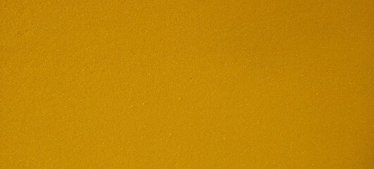 Abstract faded backdrop effect metallic gold yellow and orange blank shiny paper background texture with copy space. Reflective surface colorful design for commercial advertisement and business use.