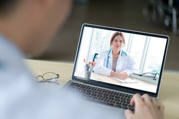 Telemedicine concept.  Person video conference with a female doctor to check her health or primary illness