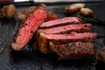 close up steak dinner with a significant slice cutting