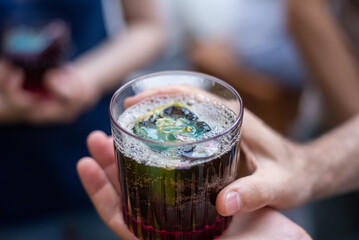 hand holding a glass