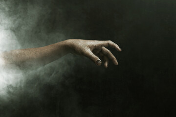 Fototapeta na wymiar Zombie hand on dark background