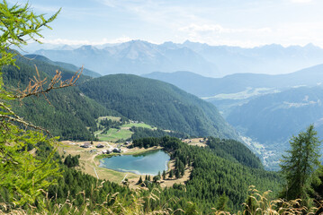 View of lago di Lod with beautiful mountain views in the background and Valtournenche valley at the...