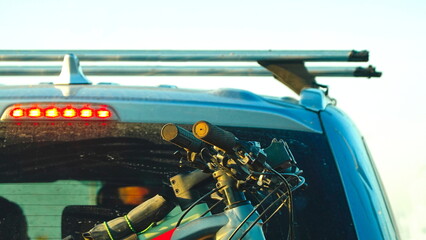 Crossover car with two bicycles loaded on a rack. Close up.