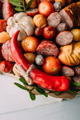 Delicious edible bouquet of sausage, tomatoes, cheese. Gift for man.
