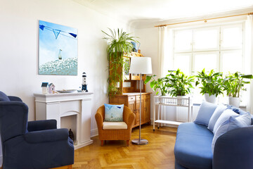Custom-made home decoration concept: living room with a canvas print of a maritime holiday photo...