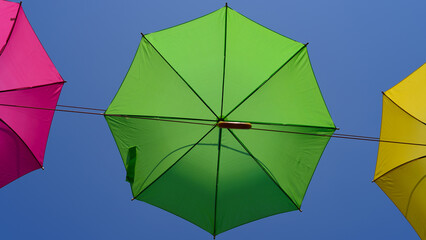 UMBRELLAS - Colorful objects on the background of the blue sky  © Wojciech Wrzesień