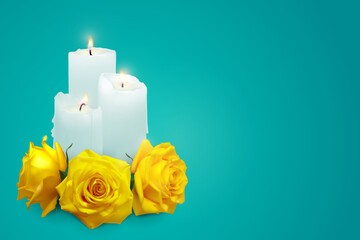 Realistic candles and yellow rosebuds on a blue background. Vector illustration