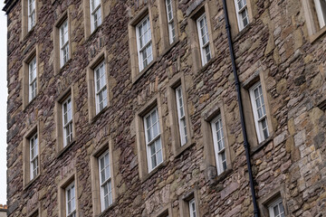 Sliding sash windows on historic stone wall period building UK