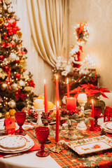 Christmas serving at home on the background of the Christmas tree.