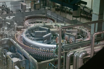 Beer production line - conveyor belt with plastic bottles. Production, manufacture, industrial...