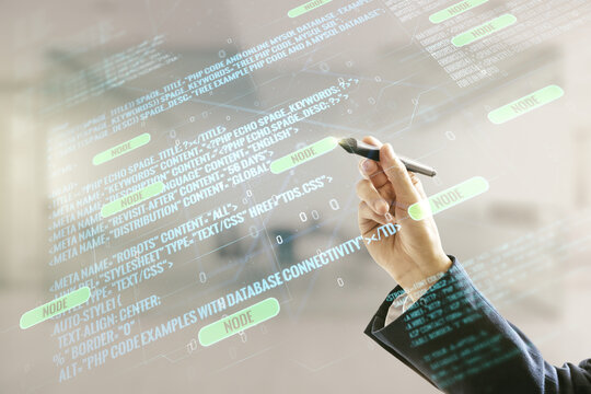 Man hand with pen working with abstract virtual coding illustration on blurred office background, software development concept. Multiexposure