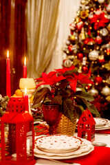 Christmas serving at home on the background of the Christmas tree.