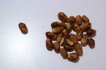 Raw Organic Dates fruit isolated on a white background