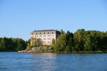 Fototapeta na wymiar Castle by the sea in the forest, photographed from the sea