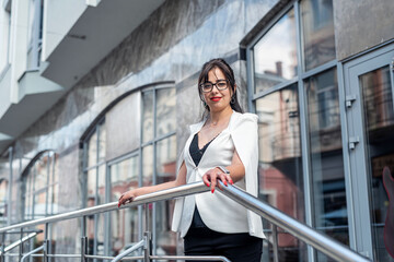 Portrait of happy business woman looking thoughtfully contemplating and thinking about career.