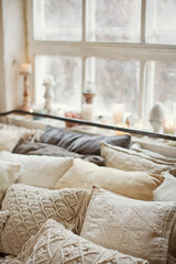 Crochet macrame pillows near window