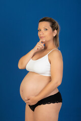 Pregnant happy woman in underwear