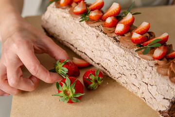 Delicious biscuit cake with strawberries. Strawberry sponge cake with fresh strawberries and sour cream. Cake roll with strawberries and cream cheese. Chocolate strawberry roll cake. Pie with cream