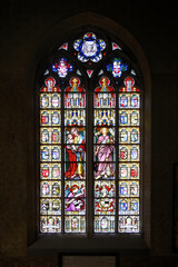 Fototapeta na wymiar Holy Blood chapel, Figurative stained-glass window, Bruges, Belgium