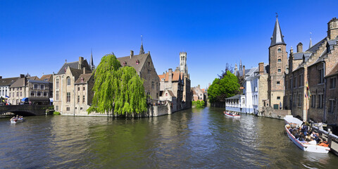 Naklejka premium Famous canal of Rozenhoedkaai and the Belfry in the background, Bruges, Belgium