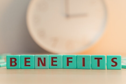 The word BENEFITS made of colorful scrabble tiles.  - Powered by Adobe