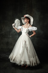 Creative portrait of young beautiful girl elegant dress of medieval fashion style with veer...