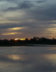 Fototapeta premium panoramic of a sunrise over the river