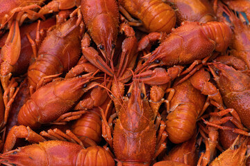 Boiled red crayfish or crawfish on a table close-up. Food background for menu. Top view, flat lay