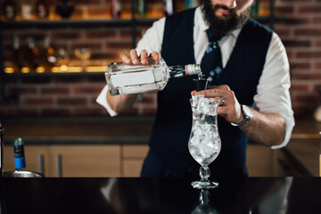 barman preparing cocktail in night club