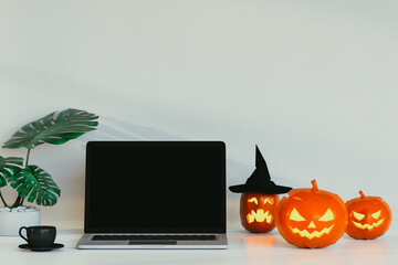 laptop with halloween pumpkins. 3D render