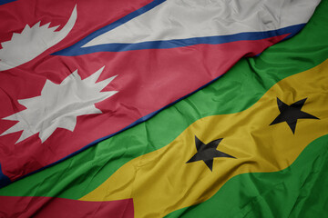 waving colorful flag of sao tome and principe and national flag of nepal.