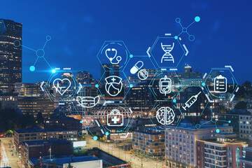 Illuminated aerial cityscape of Seattle, downtown at night time, Washington, USA. Health care...