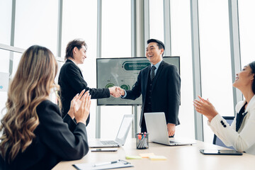 Group of professional business people are working and shaking hands while working in the creative office.