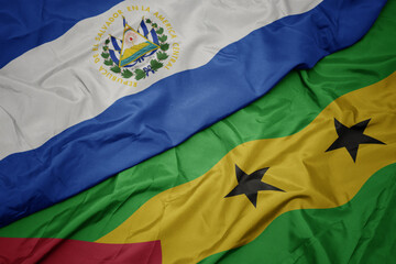 waving colorful flag of sao tome and principe and national flag of el salvador.